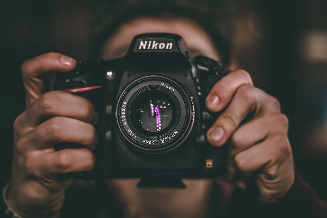 beginner holding digital camera