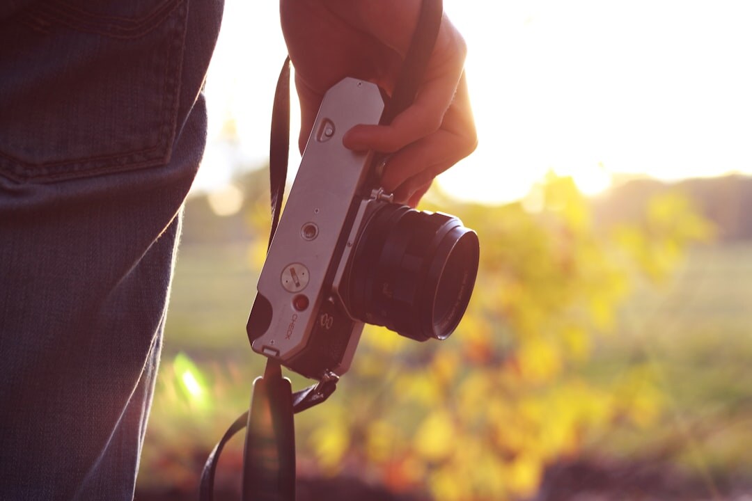beginner holding digital camera